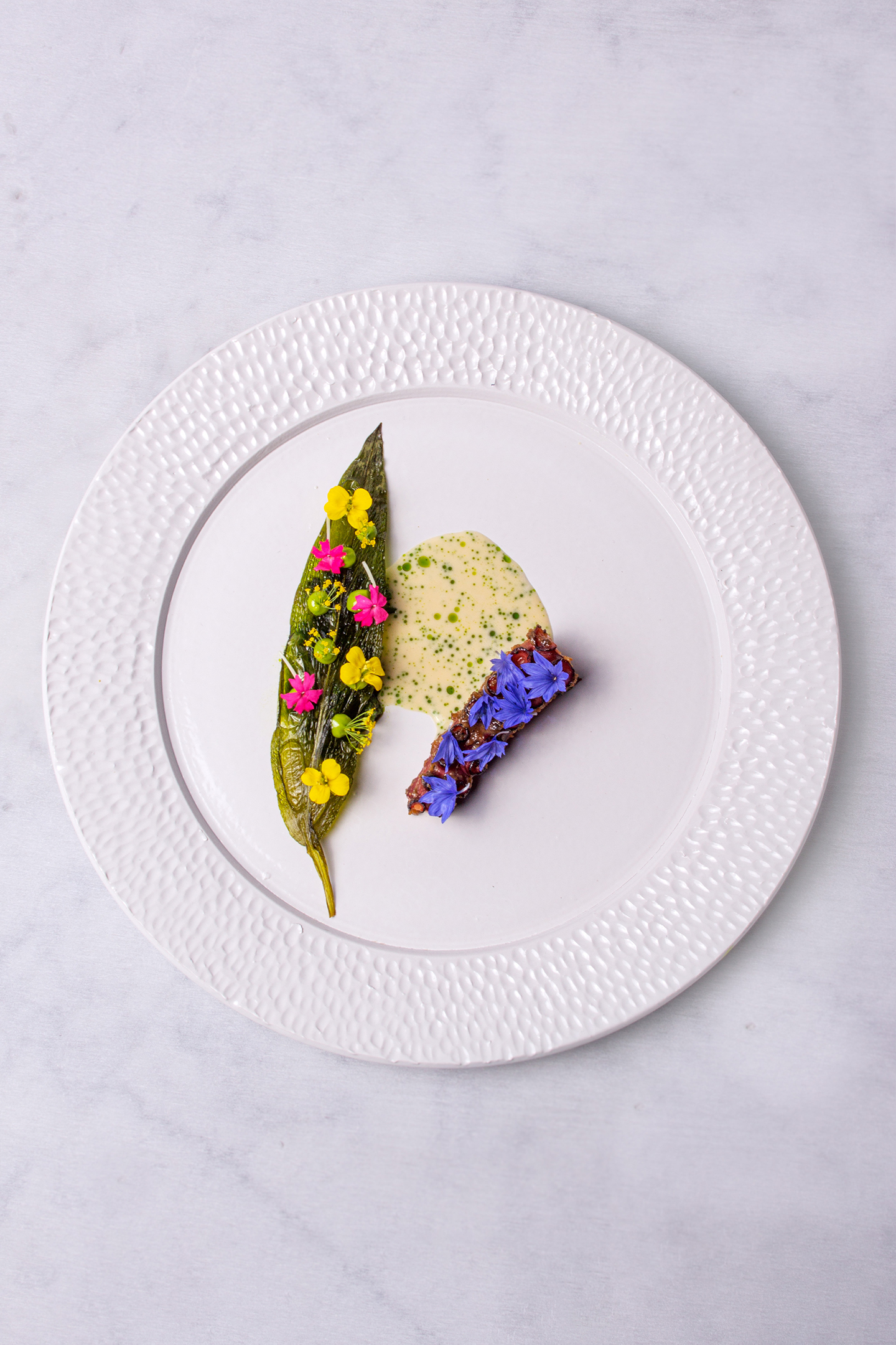 Pulpo met daslook beurre blanc en salsa verde